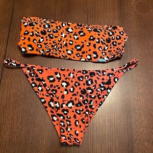 Blackbough swim. Top Medium. Bottom Large. Excellent condition.  Animal print
